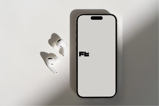 Smartphone and earbuds mockup on light background, showcasing device screen and wireless headphones for product design presentations.